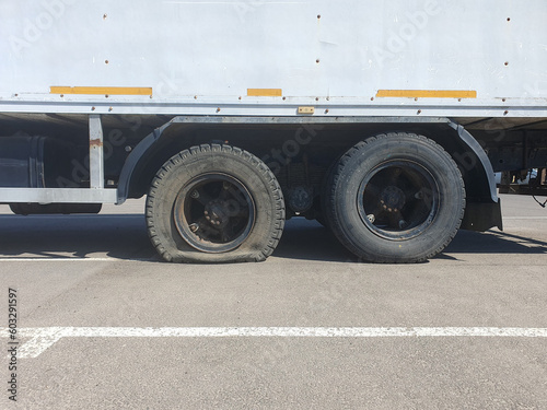 Flat tire of a heavy duty truck on the road