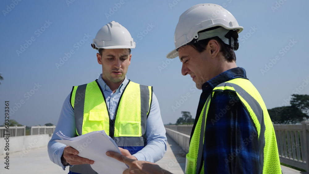 Team foreman working on construction site. He planing about construction project together. Team foreman working on construction site. He planing about construction project together.