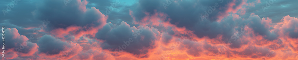 extreme wide angle background of a colorful multi colored sky at dawn in soft, muted pastel colors pink and blue