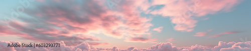 extreme wide angle background of a colorful multi colored sky at dawn in soft, muted pastel colors pink and blue