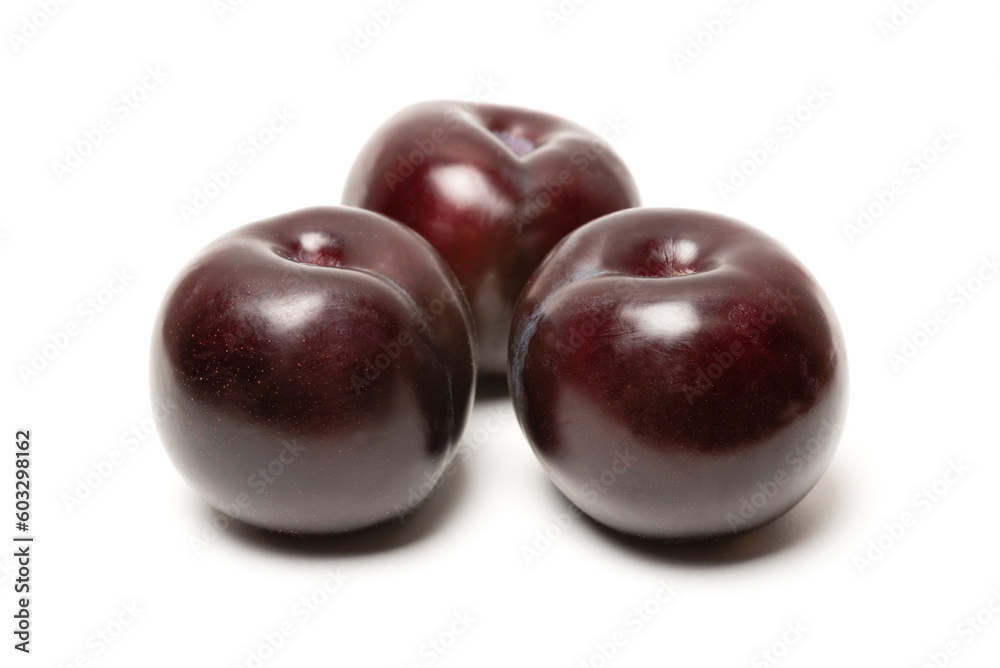 several fresh ripe plum on a white background several fresh ripe plum on a white background