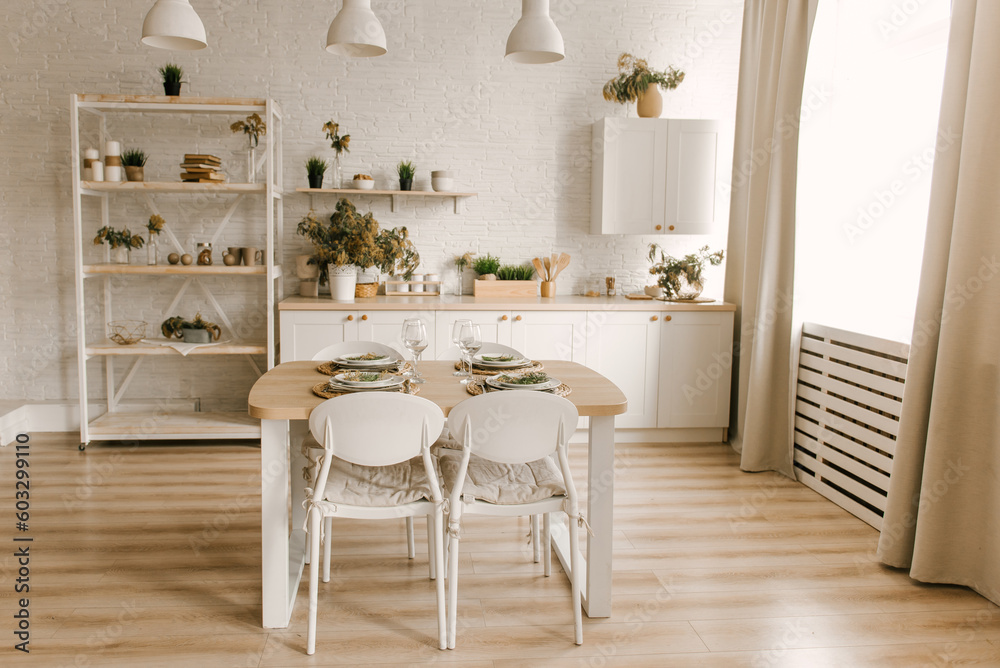 Kitchen white wooden kitchen with Scandinavian-style dining area decorated with mimosa