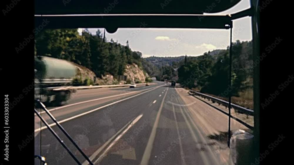 JERUSALEM, ISRAEL - CIRCA 1981:Vintage footage, point of view of a tourist bus driving on the highway to Jerusalem city on 80s, Israel. Historic restored footage on 1980s.