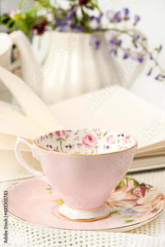 Decorative tea cup with a book