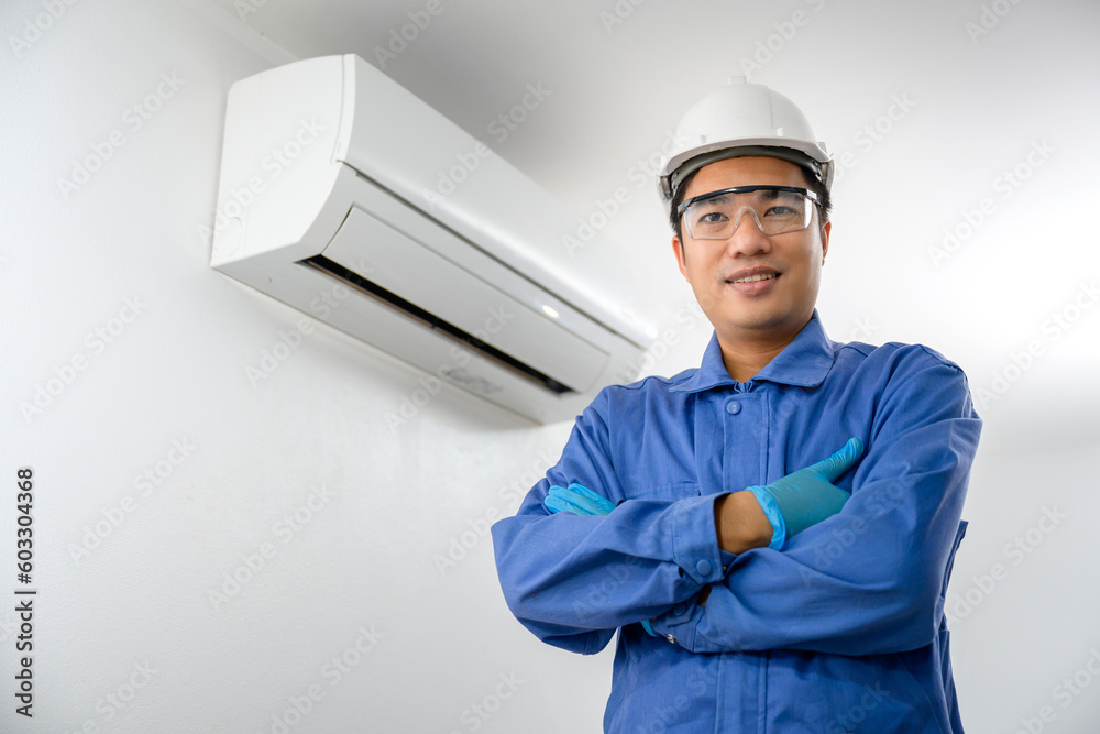 Picture of a male air conditioner technician, repair service, install air conditioner in the house repair and maintenance Clean air conditioners in homes and buildings. Picture of a male air conditioner technician, repair service, install air conditioner in the house repair and maintenance Clean air conditioners in homes and buildings.