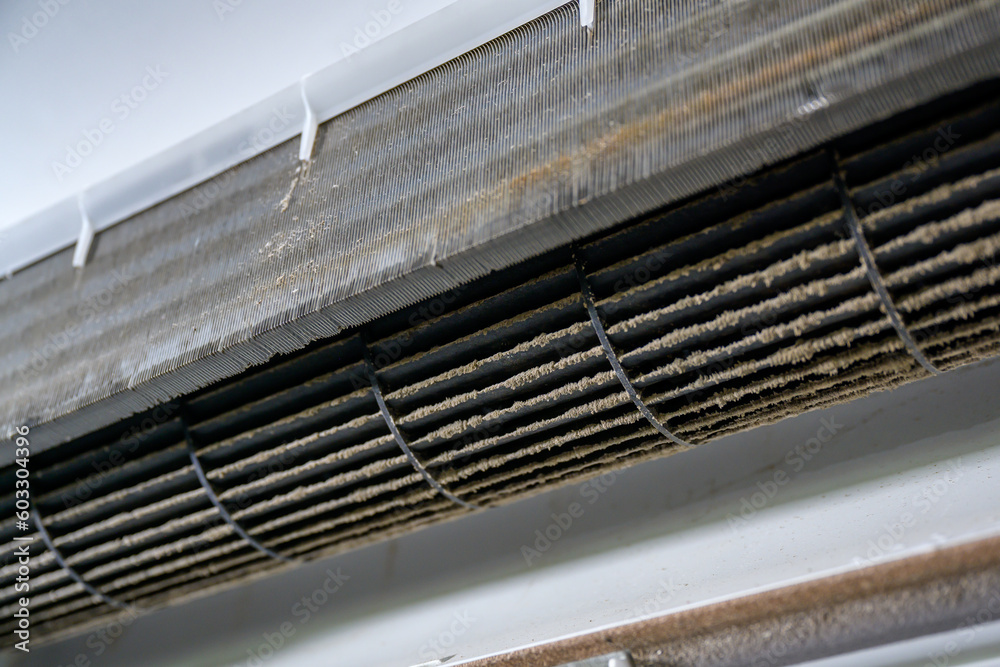 Fototapeta premium Close up of dirty dust on the air conditioner filter. Accumulation of dust requiring replacement of the air filter in the air conditioner For the health safety of the air conditioner in the house