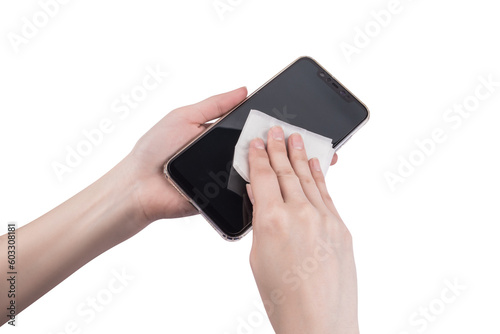 Holding an alcohol containing disinfectant wipes in hand while wiping items
