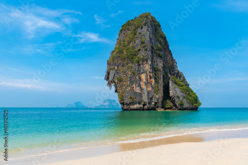 horizontal photo, island closeup, phra nang beach in Thailand, paradise, sunny beach, sunbathing and swimming in the sea, blue ocean and sky, relaxation and enjoyment