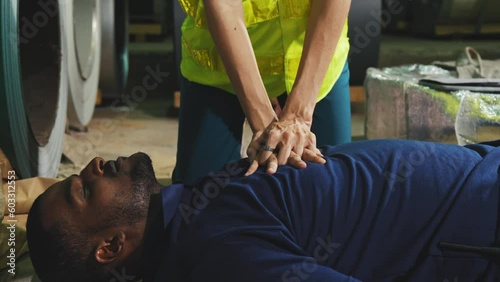 Emergency on worker in factory, First aid emergency CPR on heart attack Man , One part of the process resuscitation - Healthcare concept.