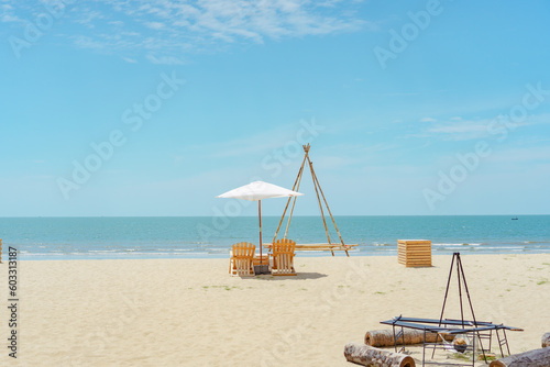 Wooden chair camping on beach vacation summer beautiful sea view with horizon. Tropical holiday banner background. Calmness and relaxation concept. Beach party.