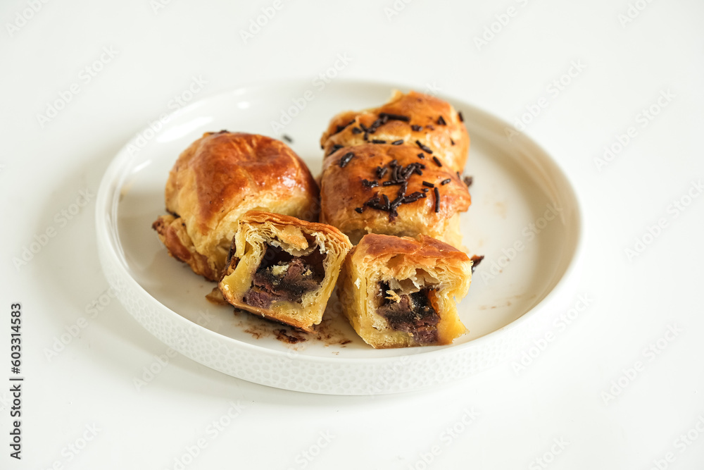 pisang bolen is made from bananas covered in rolled sheet of pastry dough filled chocolate and cheese
