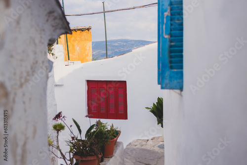 Anafiotika village street view in historical Plaka neighborhood, Attica, Athens, Greece, with a traditional colorful greek houses in a sunny day photo