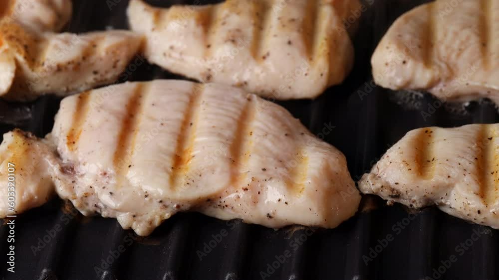 Cook electric grilling Delicious juicy fillet chicken breast. meat grill season. meat in your own juice without oil, goes Steam from frying Cook electric grilling Delicious juicy fillet chicken breast. meat grill season. meat in your own juice without oil, goes Steam from frying