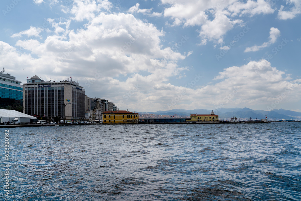 Izmir, Turkey - April 28 2023: View of Konak district with passport ferry port from Aegean sea