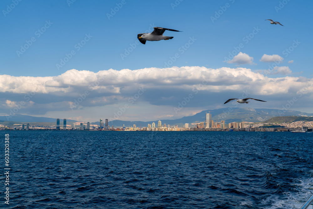 Naklejka premium Izmir, Turkey - April 28 2023: View on Izmir downtown from Izmir's bay