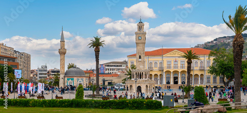 Izmir, Turkey - April 28 2023: Panoramic view of Konak Square with old clock tower, mosque and the Konak