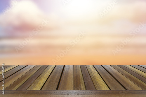 Mock up view of brown old teak wooden table top with ocean beach blurred background.