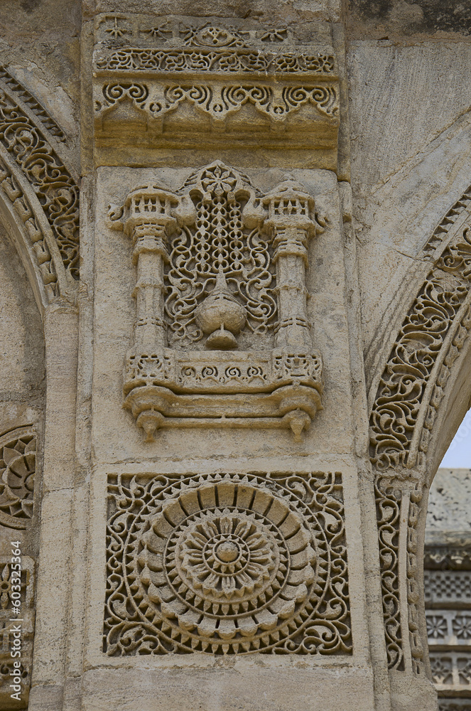 Carving details on the outer wall of Nagina Masjid (Mosque), built with pure white stone. UNESCO protected Champaner - Pavagadh Archaeological Park, Gujarat, India