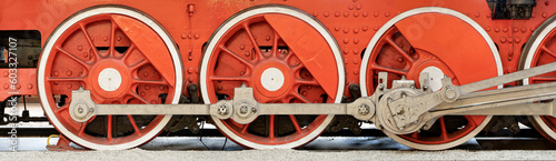 Big red wheels of a steam locomotive