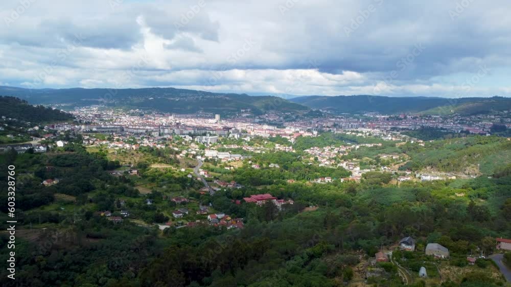Panoramic view of ourense spain nestled in green lush valley from pereiro de aguiar, aerial Panoramic view of ourense spain nestled in green lush valley from pereiro de aguiar, aerial