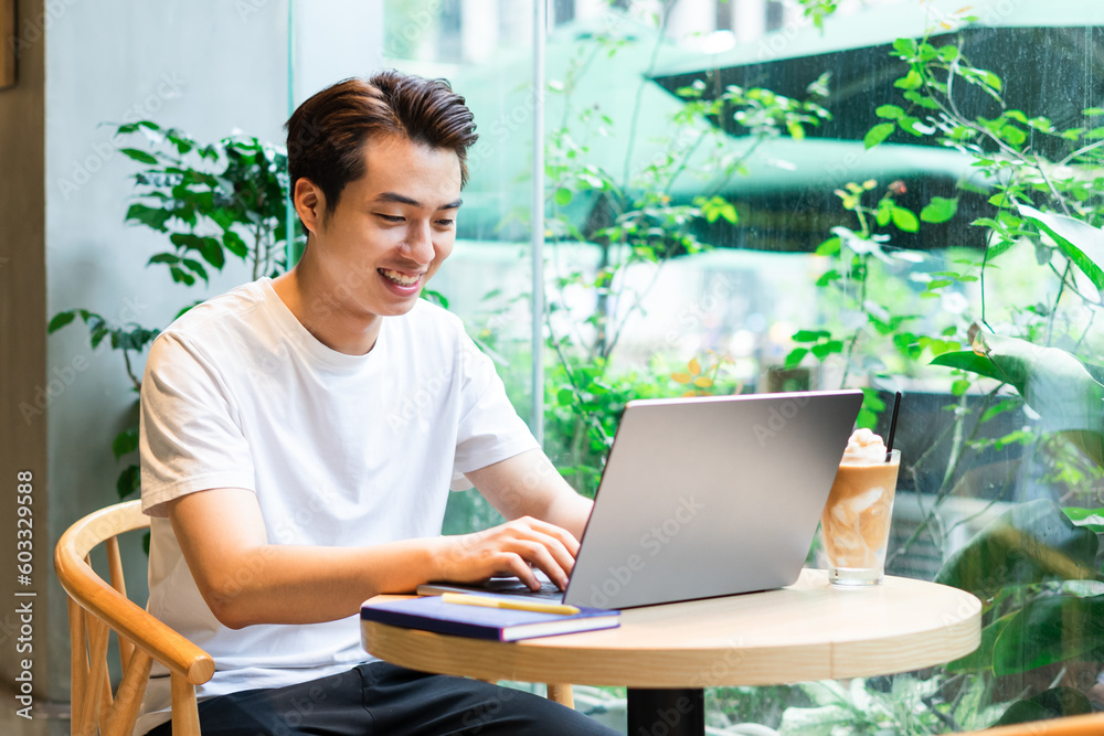 Asian man sitting at coffee shop Asian man sitting at coffee shop
