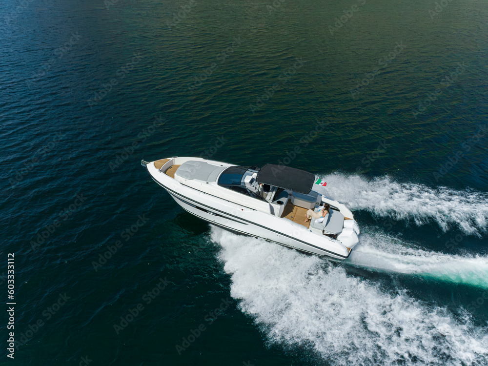 young amazing woman relax on the yacht, aerial view young amazing woman relax on the yacht, aerial view
