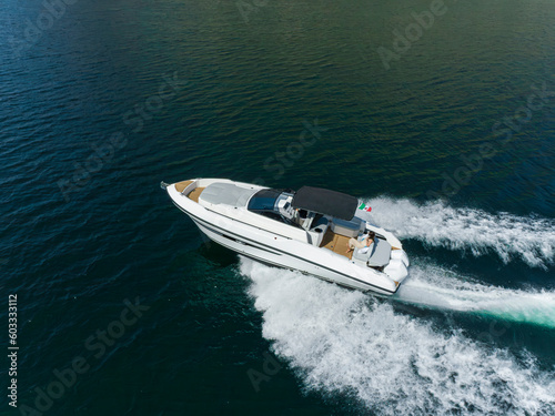 young amazing woman relax on the yacht, aerial view © Andrea