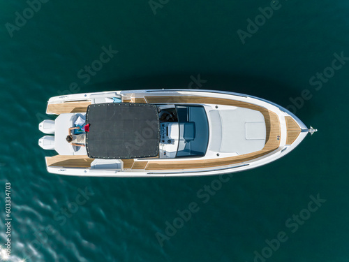 young amazing woman relax on the yacht, aerial view © Andrea