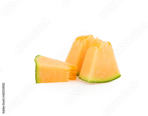 small pieces of cantaloupe melon isolated on white background.