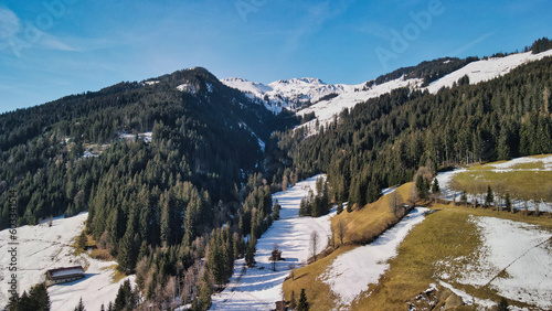 A mountain landscape at the end of winter in tirol - drone footage
