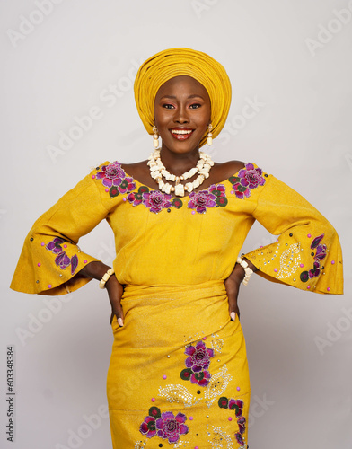 Portrait of gorgeous African woman dressed in  Nigerian traditional dress. photo