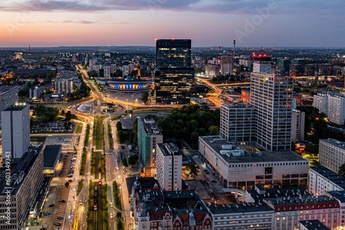 Aerial drone photo of Katowice centre with roundabout and modern office towers at evening. Katowice  Silesia  Poland