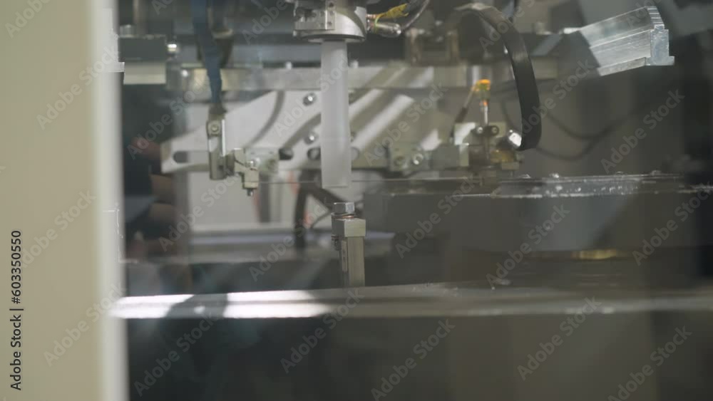 Plastic Tubes Cut By Industrial Automated Mechanism Of Production Machine. Automated Factory Manufacturing. Cutting Tubes For Raw Material Processing. Automated Equipment Cuts Plastic Tubes Plastic Tubes Cut By Industrial Automated Mechanism Of Production Machine. Automated Factory Manufacturing. Cutting Tubes For Raw Material Processing. Automated Equipment Cuts Plastic Tubes
