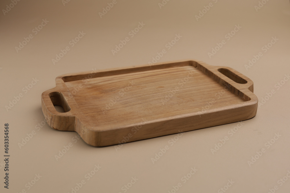 Fototapeta premium Wooden cutting board on the table, isolated