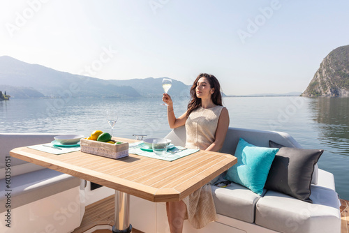 young amazing woman drink in relax on the yacht