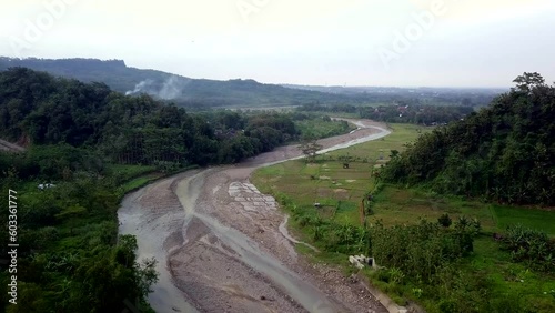 a view of rice fields and river photo