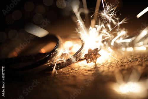 Macro shot of Wedding rings gold with sparks