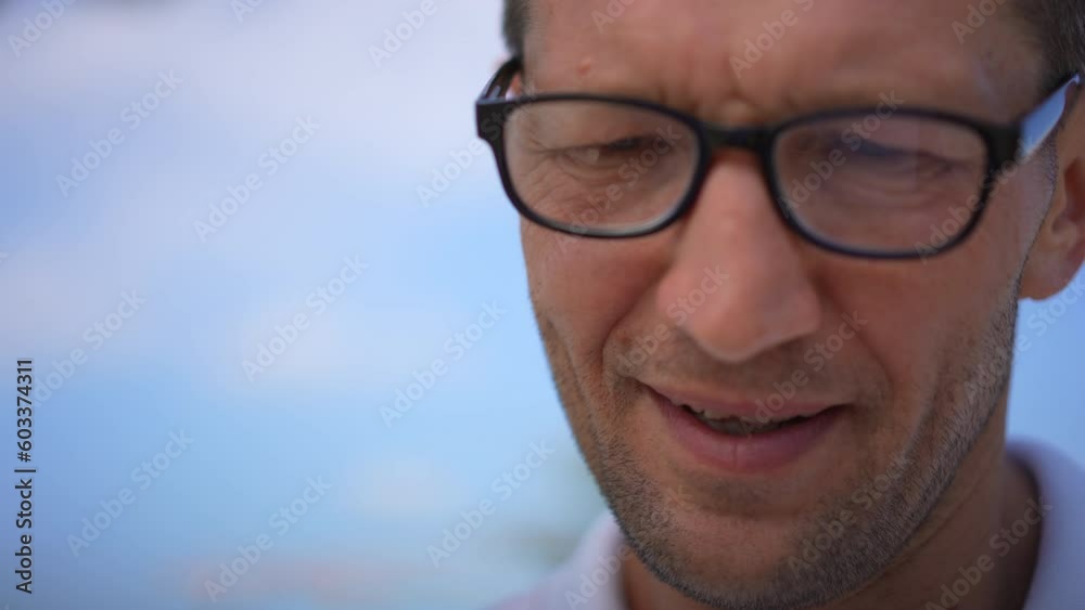 Headshot portrait of handsome talented adult man in eyeglasses thinking creating art outdoors. Close-up face of concentrated Caucasian designer thinking writing script drawing sketch Headshot portrait of handsome talented adult man in eyeglasses thinking creating art outdoors. Close-up face of concentrated Caucasian designer thinking writing script drawing sketch