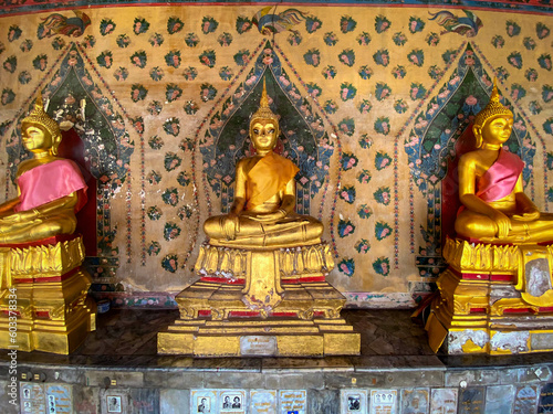 Gallery with old vessels of the seated Buddha in the Buddhist temple Wat Arun. Bangkok, Thailand