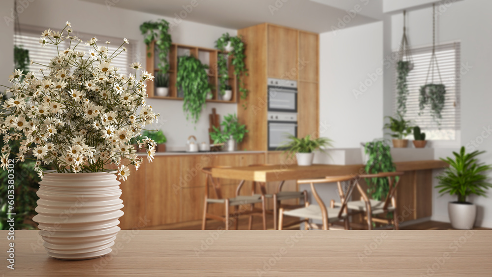 Wooden table top or shelf with pottery vase with daisies, wild flowers, over kitchen and dining room in urban jungle style, houseplants, interior design concept