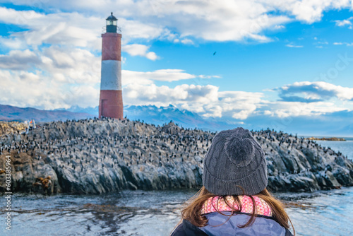 Woman watching famous ushuaia lighthouse