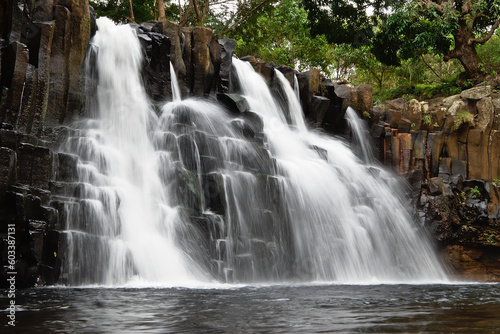 A beautiful waterfall amongst rocks. Nature background.