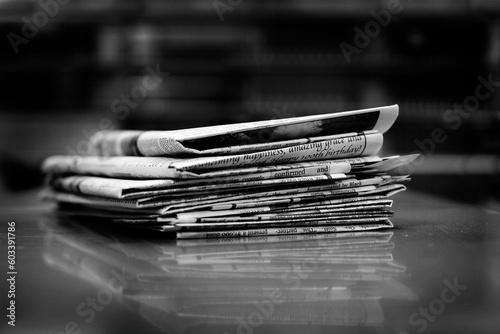 Stacks of Old Newspapers Printed Paper with News Headlines photo