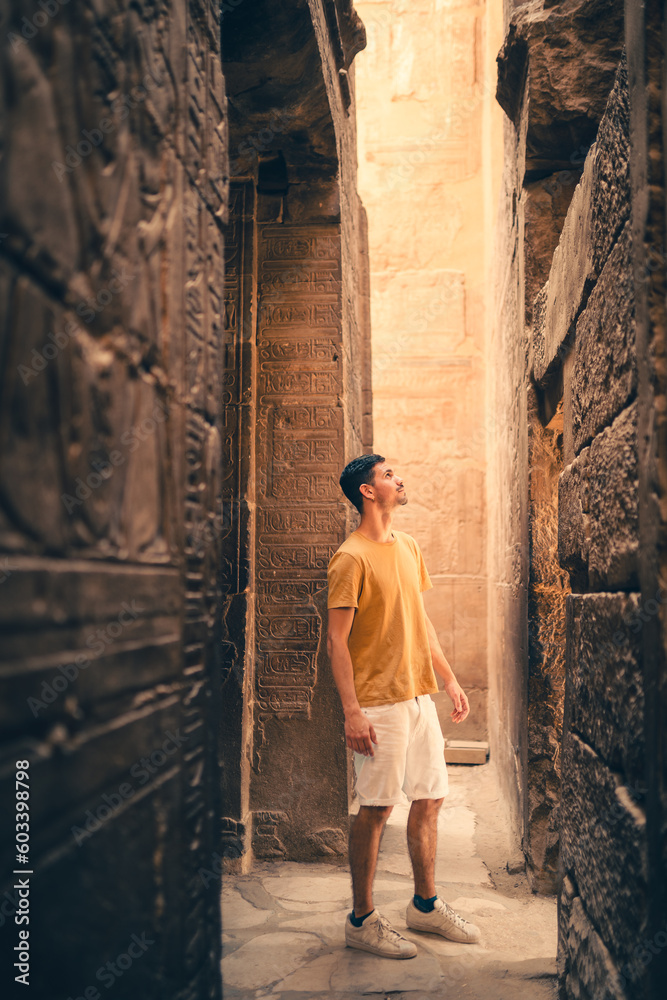 young male traveler visits Karnak temple in Luxor, Egypt