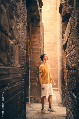 young male traveler visits Karnak temple in Luxor, Egypt