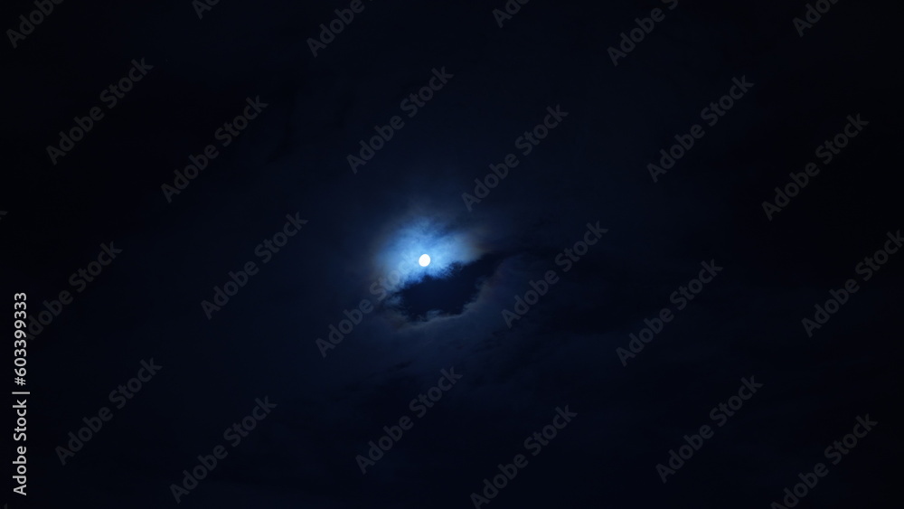 The moon night view with the round and white moon in the sky The moon night view with the round and white moon in the sky