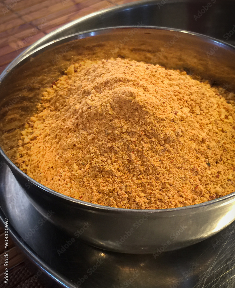 Indian chutney powder in a small steel bowl Indian chutney powder in a small steel bowl