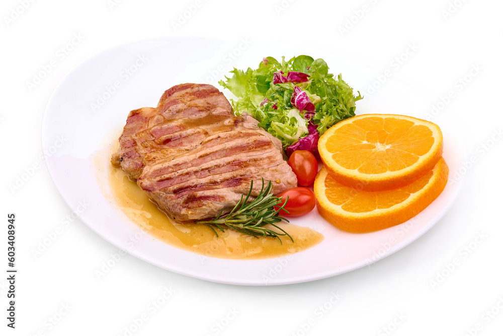 Grilled beef steak with potato wedges, grilled pears, isolated on white background.
