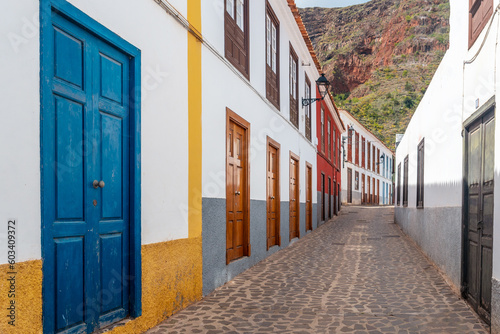 Colored doors and windows to the streets in the village of Agulo in the north of La Gomera in summer, Canary Islands