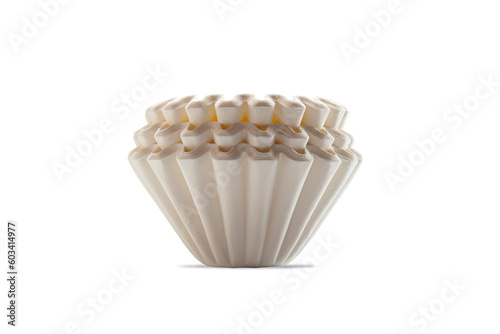 Side view closeup stack of new unbleached basket-type disposable paper coffee filters isolated on white background with clipping path.